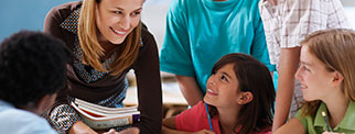 Teacher talking with students in class
