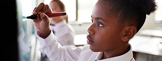 Student using an interactive whiteboard